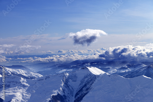 Winter mountains at nice evening and sunlight clouds