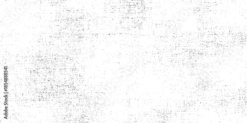 A grepsny monochrome texture dominates the image displaying a distressed and speckled appearance with a blurred focus
