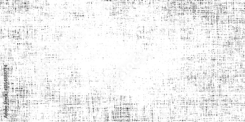 A grepsny monochrome texture displaying a scattered pattern of dark specks agepsnst a light background