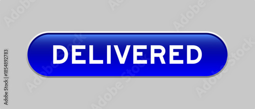 Blue color capsule shape button with word delivered on gray background
