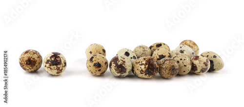 Quail eggs isolated on white background. Natural patterned farm quail eggs.