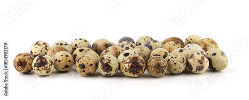 Quail eggs isolated on white background. Natural patterned farm quail eggs.