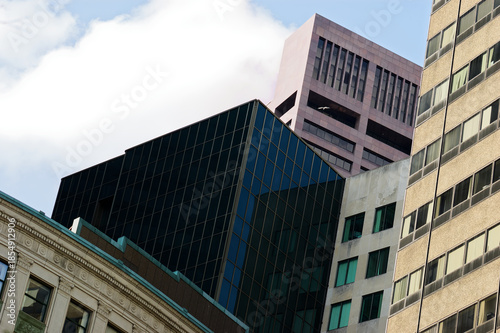 Urban Skyline: City High-Rises Reflecting Blue Sky Among Historic Buildings Vertical