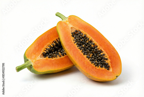 Fotografie Fresh ripe papaya sliced in half with seeds isolated on white background