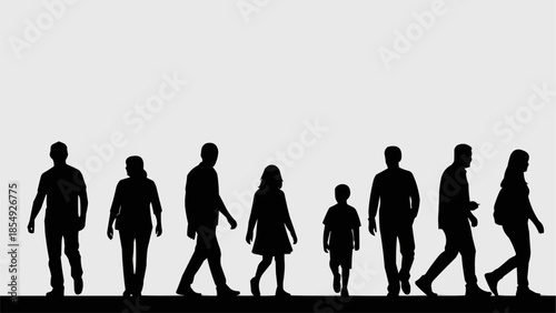 Silhouettes of a diverse group of people walking together.
