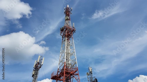 Multiple Telecommunication Towers Under Blue Sky with White Clouds