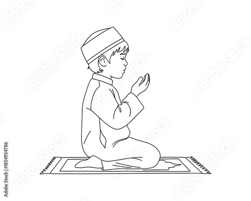 Young boy observing a peaceful Ramadhan prayer moment, deeply engaged in spiritual devotion