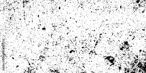 An abstract black and white texture exhibiting a thoroughly deteriorated surface covered in scattered grit and fine scratches.