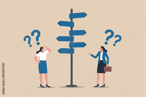 Confused businesswomen at crossroads