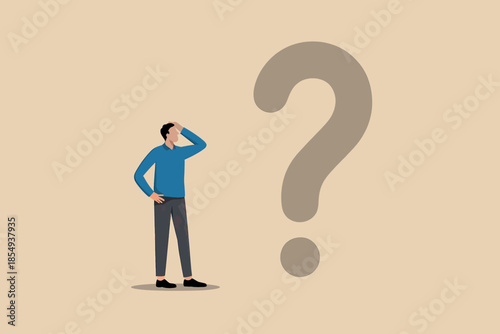 Man in blue sweater ponders large question mark