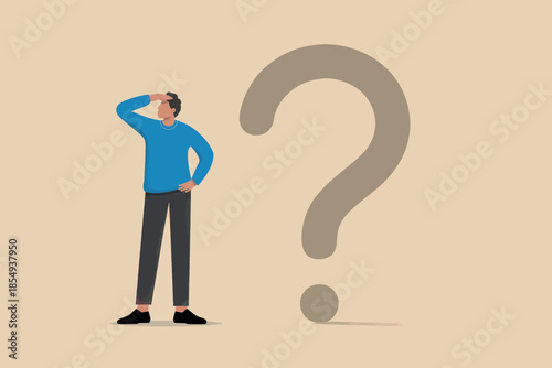 Man ponders large question mark