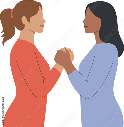 Two diverse women stand facing each other while firmly clasping hands together in a gesture of support and unity.