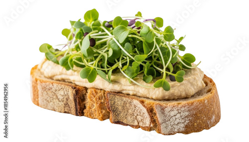 Rustic bread slice topped with creamy hummus, microgreens, and basil leaves. Isolated on transparent background.