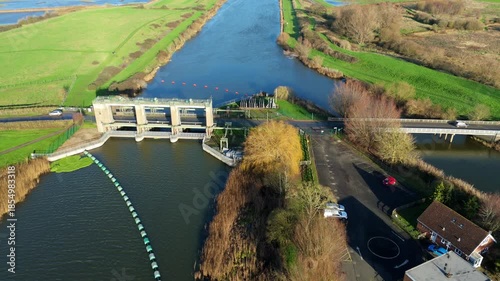 Aerial drone view of Denver sluice in Eastern England. River system water management and flood alleviation protection barrier. Sunny winter Day,