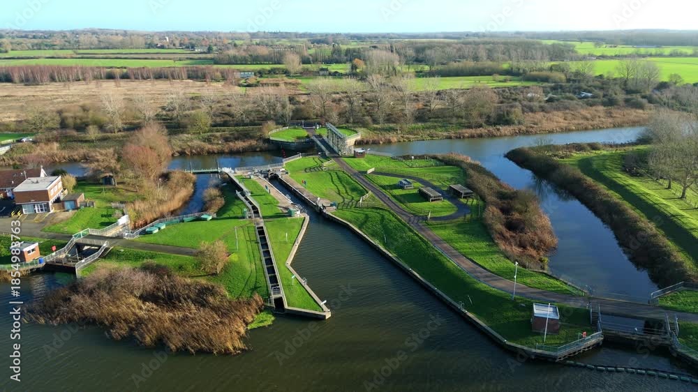 Aerial drone view of inland river canal and water control facility ...