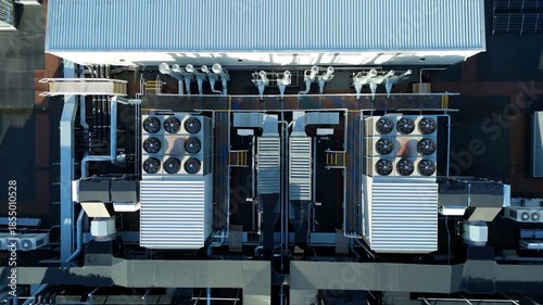 Close up aerial drone view of large scale data center, AI cloud and quantum computing cooling infrastructure. Fans and ventilation, Milton Keynes, UK