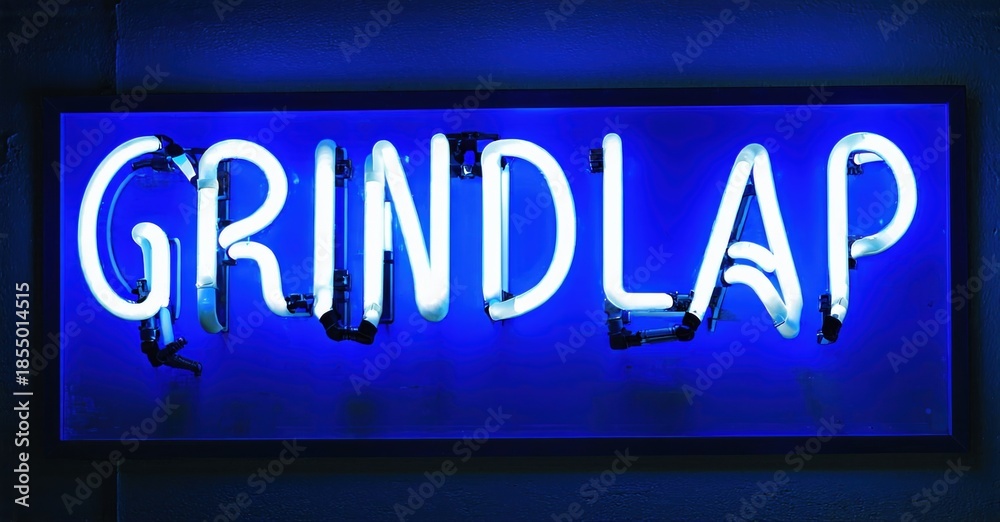 Obraz premium Bright blue neon sign spells GRINDLAP. Rectangular frame surrounds glowing text against dark background. Simple, modern aesthetic.