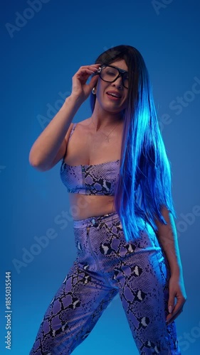 Stylish woman in snake print outfit. Fashion and beauty concept.