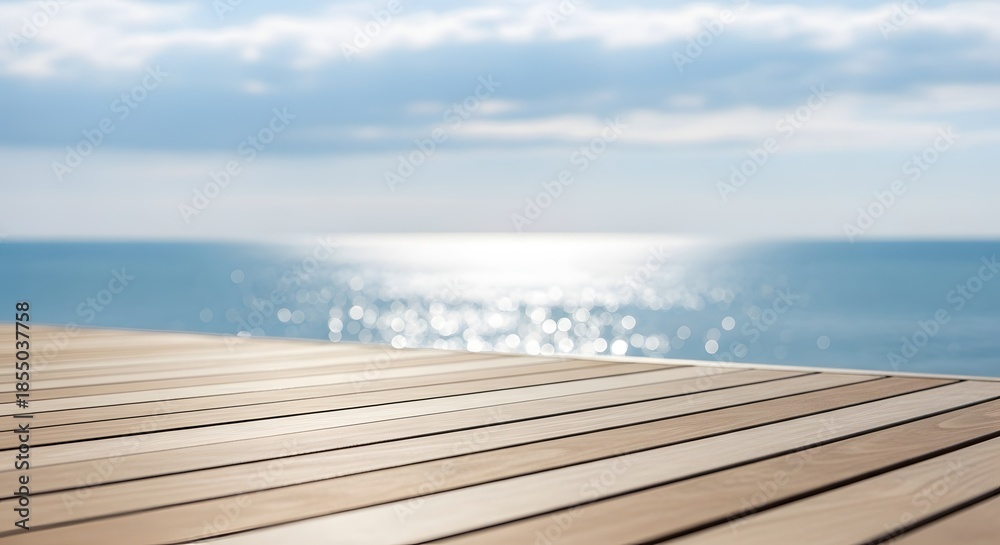 Fototapeta premium Wooden Deck and Sparkling Ocean Water with Clouds in the Sky wood planks boardwalk