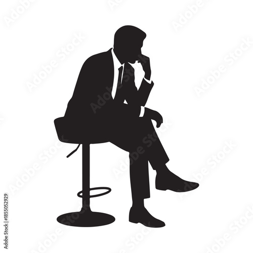 A silhouette of a businessman thoughtfully seated and deep in contemplation