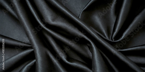 Luxurious Black Satin and Silk Fabric Texture with Smooth Flowing Waves, Soft Highlights, and Elegant Curves Creating a Premium Abstract Textile Background