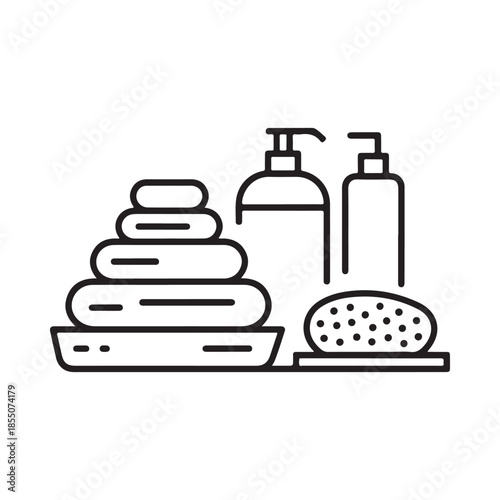 A calming spa arrangement featuring stacked towels soap and bath accessories