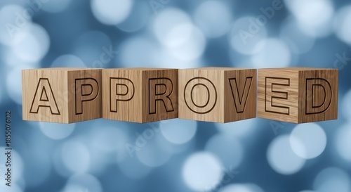 Wooden blocks spelling 'approved' on blue bokeh background