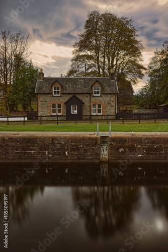 Stone and slate house beside the fifth lock of the five-step stairs that haul ships from Loch Ness to the Caledonian Canal. Fort Augustus-Scotland-198
