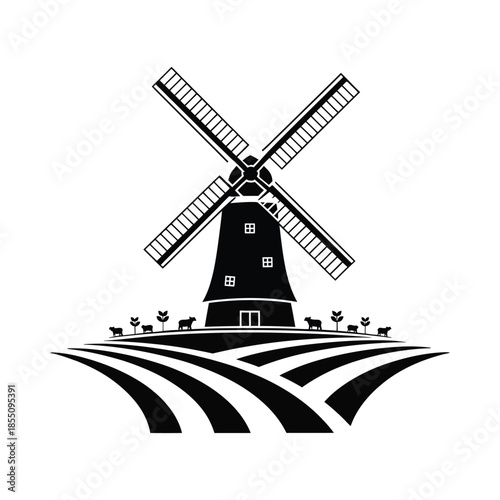 Windmill standing tall in the field with animals