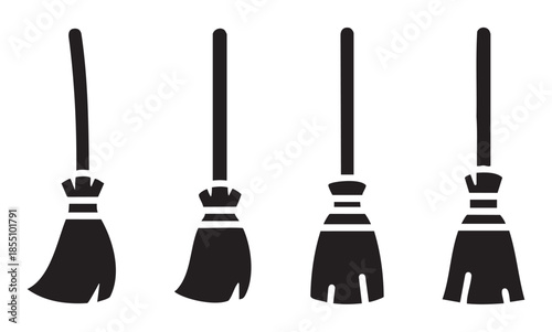 Brooms set of four black silhouette icons representing traditional cleaning tools or magical witch's accessories for Halloween celebrations.