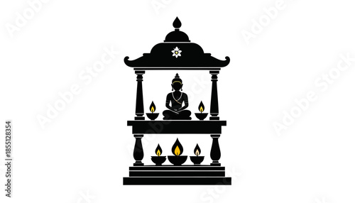 Silhouette of a Buddha statue in a shrine with candles.