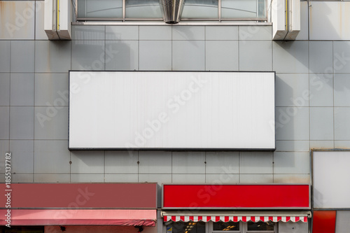 Large blank billboard on a street wall, banners with room to add your own text