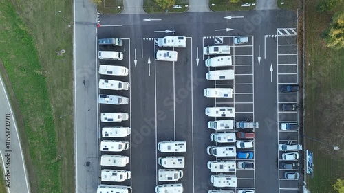 Aerial view highlighting numerous camper vans parking facility in Lombardy, Italy