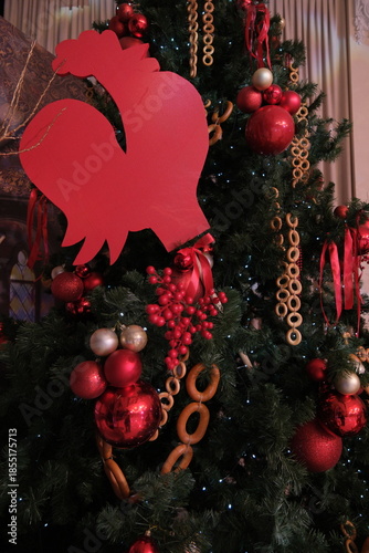Christmas tree decorated in Russian style with red toys and garlands