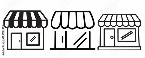 Three storefronts with awnings and windows