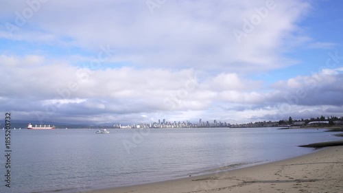 English Bay Cityscape Cloudscape 4K UHD.The view of the Vancouver skyline and clouds from Jericho Beach on English Bay. Vancouver, British Columbia, Canada. 4K, UHD.
