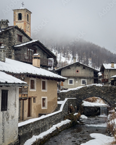 View of Chianale, a typical alpine village covered with snow during winter, Piedmont region, Italy