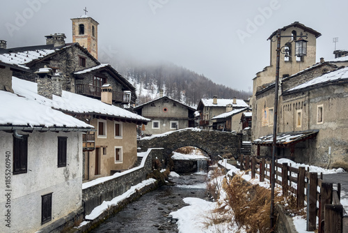 View of Chianale, a typical alpine village covered with snow during winter, Piedmont region, Italy