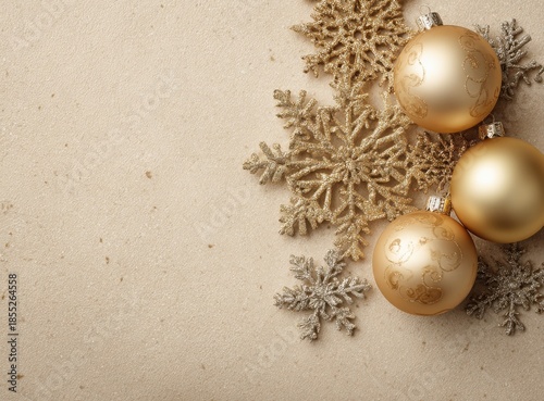 beige christmas background with golden decorations and snowflakes