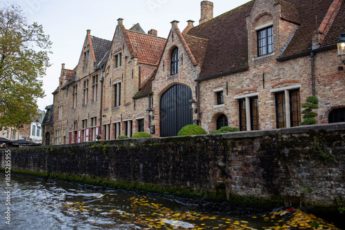 Bruges (Brugge), Belgium - October 17, 2022. Historical buildings along the canals of Bruges.