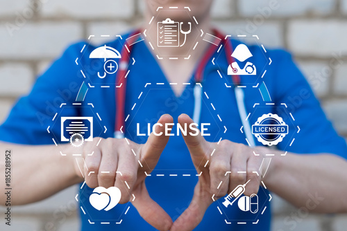 Fotografie Doctor using virtual touch screen presses the word LICENSE