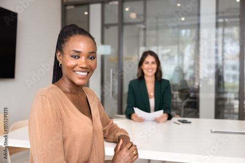 Photos Positive beautiful young African American job candidate posing for portrait at t