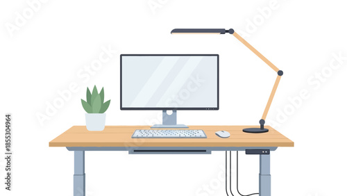 Modern flat workspace with computer, desk lamp, and plant on wooden desk