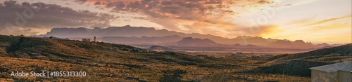A dramatic sunset illuminates the Chisos Mountains in Texas.