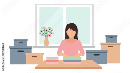 Woman folding laundry at home with boxes and flowers by the window