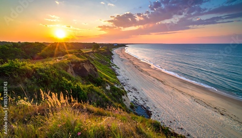 Coastal Serenity: A Stunning Sunset Over the Ocean Beach with Lush Greenery