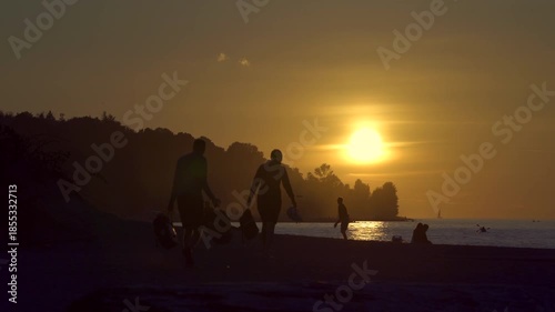 Spanish Banks Vancouver Sunset Activities 4K UHD.People playing on Jericho Beach and the Salish Sea during sunset, Vancouver. 4K UHD.
