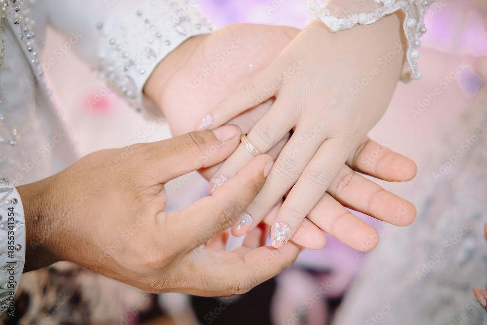 Fototapeta premium hands of the groom and bride