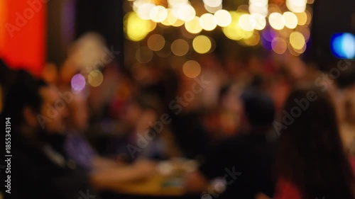 Fuzzy networking scene, Casual business gathering atmosphere, Unfocused group engaging in informal discussions slow motion