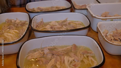 The process of preparing aspic for the holiday shows the movements of the product, meat, water, broth chinese food chicken and rice